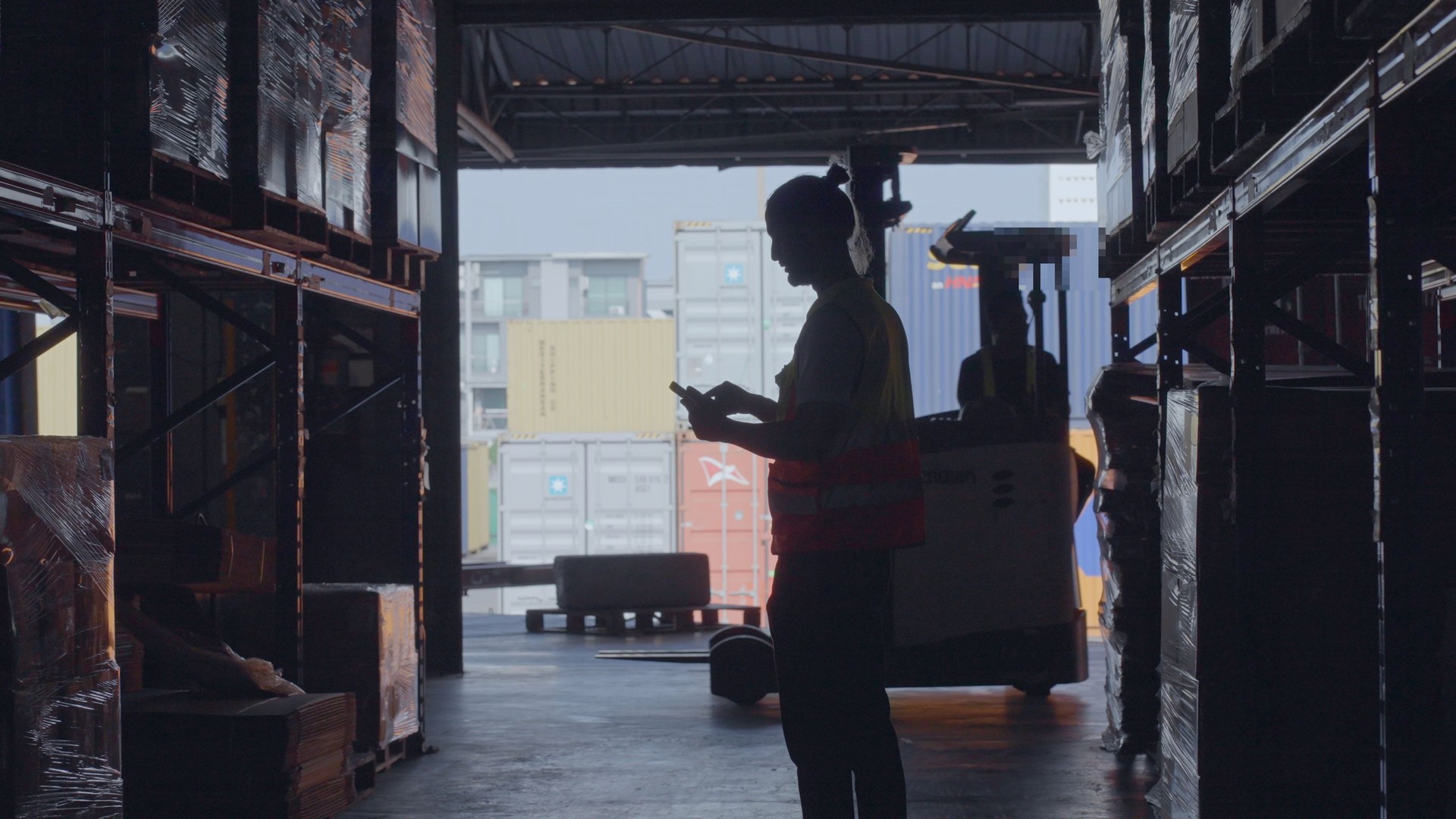 Professional warehouse workers checks products stock inventory with digital tablet in warehouse full of shelves, Workers employee doing work in storehouse. Concept of people, logistics, transportation, delivery, and distribution center.